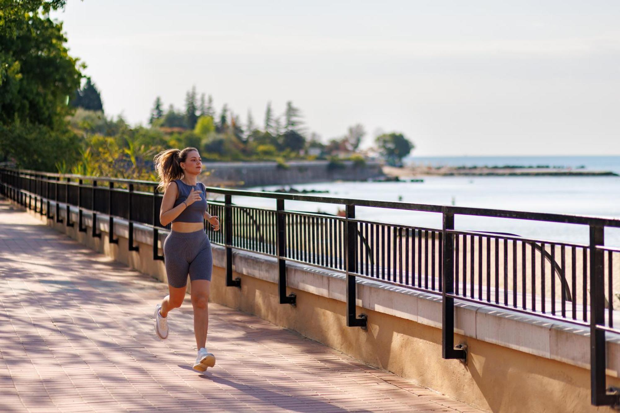 Dreams Sunny Beach Resort And Spa Экстерьер фото A woman jogging along the Lake Michigan shoreline